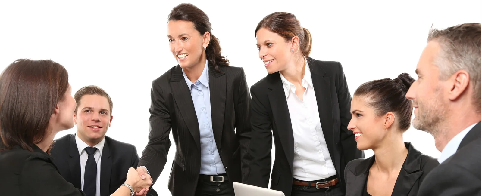 Insurance professionals shaking hands with clients