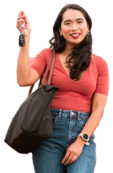 A happy customer holding her new car keys