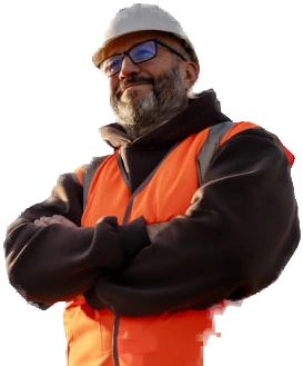 A smiling construction worker in a hard hat and safety vest